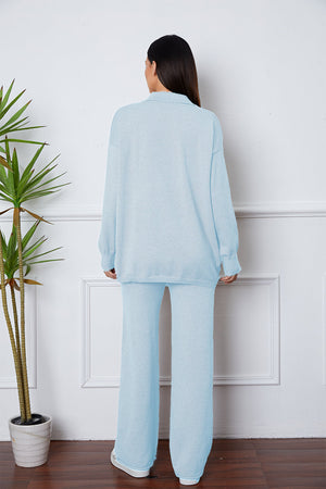 Relaxed knit polo co-ord set in Misty Blue, featuring a collared long-sleeve top and wide-leg pants.
