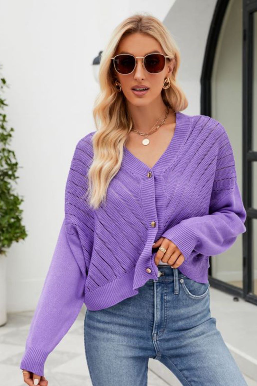 Purple textured stitch cropped V-neck cardigan with button front and long sleeves.
