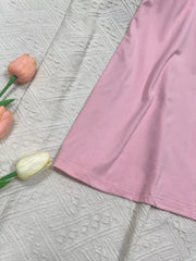 Pink scoop neck cami activewear top with a hem detail.