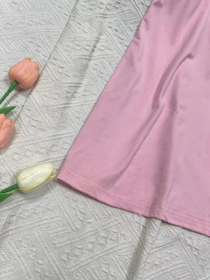 Pink scoop neck cami activewear top with a hem detail.