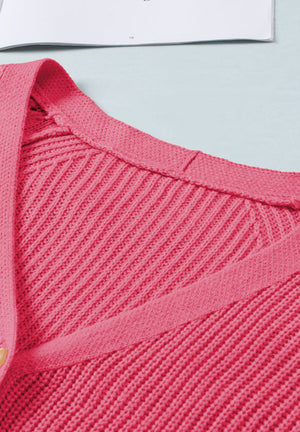Hot Pink Diamond-Cut Sleeve Knit Cardigan with ribbed texture and button detail.