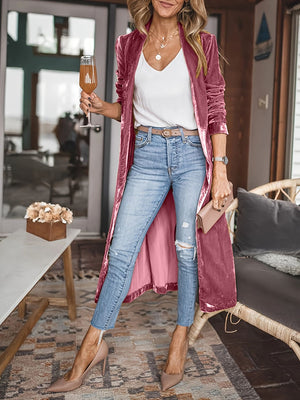 Burgundy velvet duster coat with fluid silhouette, open front, long sleeves, and a pink lining.