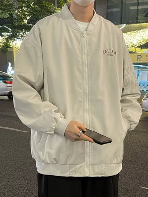 Apricot casual bomber jacket with zip front and embroidered chest detail.