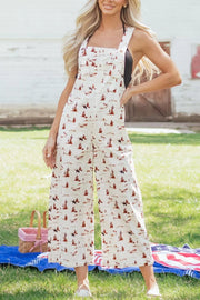 Desert motif adjustable jumpsuit in beige cotton with cropped wide legs and a desert scene print.