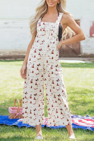 Desert motif adjustable jumpsuit in beige cotton with cropped wide legs and a desert scene print.