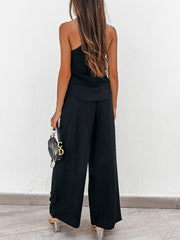 Black pleated palazzo pants and cami set with wide legs and a chic silhouette.