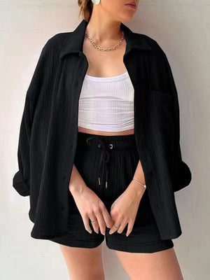 Black textured gauze button-up shirt and drawstring shorts set styled with a white crop top.