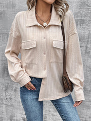 Beige textured overshirt with relaxed fit, button front, and dual chest pockets.