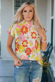 Floral blouse with smocked neckline and butterfly sleeves