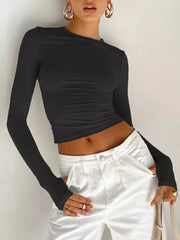 Black long sleeve polyester t-shirt with ruching detail and thumbholes.
