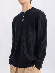 Men's black ribbed knit top with three button henley neckline.