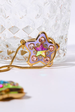 Lavender starburst pendant necklace with pink heart and clear gems on gold chain