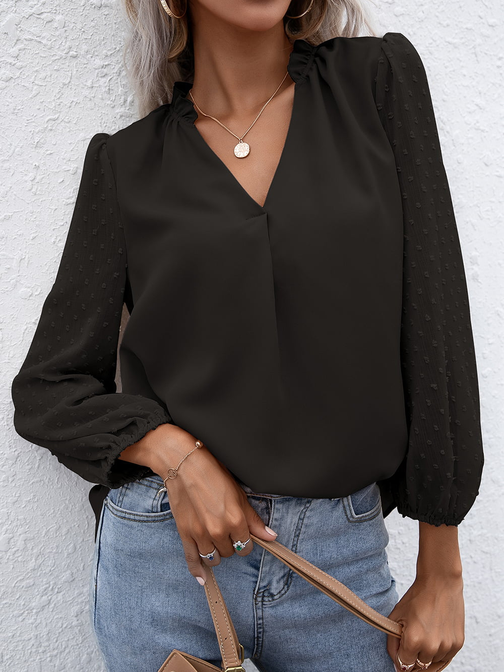 Black Swiss dot sleeve gathered blouse with V-neck and ruffled collar.