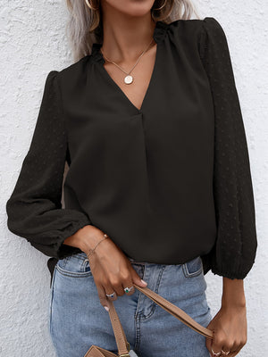 Black Swiss dot sleeve gathered blouse with V-neck and ruffled collar.