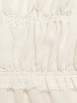 Gathered neckline peplum cami top in white with ruffled hem detail