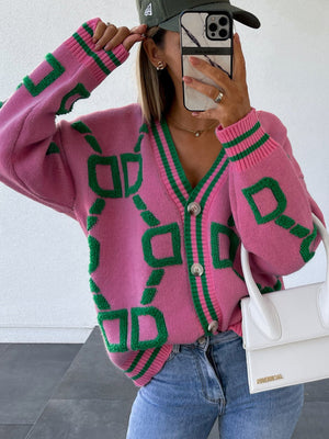 Hot Pink acrylic cardigan with green geometric chain pattern, button front, and striped trim.