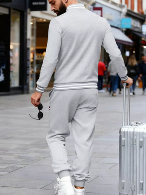 Men's light gray striped tracksuit set with ribbed cuffs and collar, perfect for activewear.