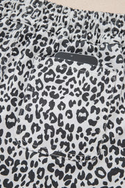 Leopard print denim skort with pockets and elastic waistband.