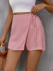 Blush pink textured wrap skort with tie detail and a slight crinkle fabric.