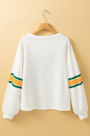 White raglan sleeve sweatshirt with green and orange stripes on sleeves.