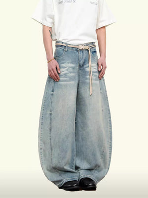 Belted wide leg denim jeans in light blue, 100% cotton, with a balloon silhouette.