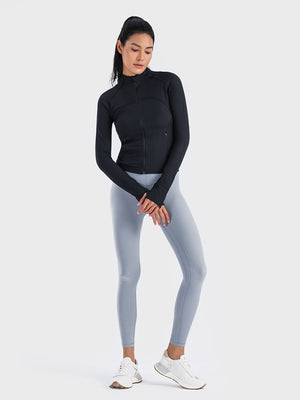 Black ribbed performance zip-up track jacket with thumbholes and zippered pockets.