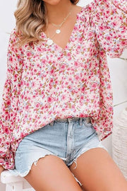 Floral puff sleeve v-neck blouse in blush pink with a delicate floral print.