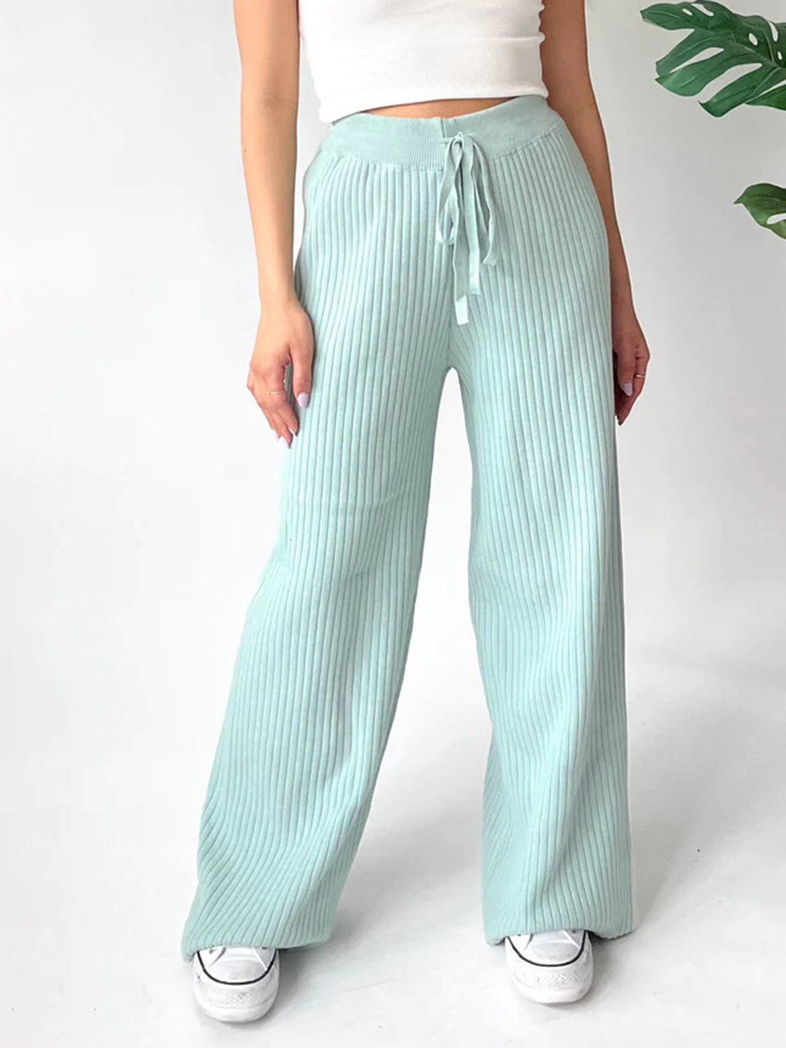 Mint blue ribbed knit palazzo trousers with drawstring waist and wide leg