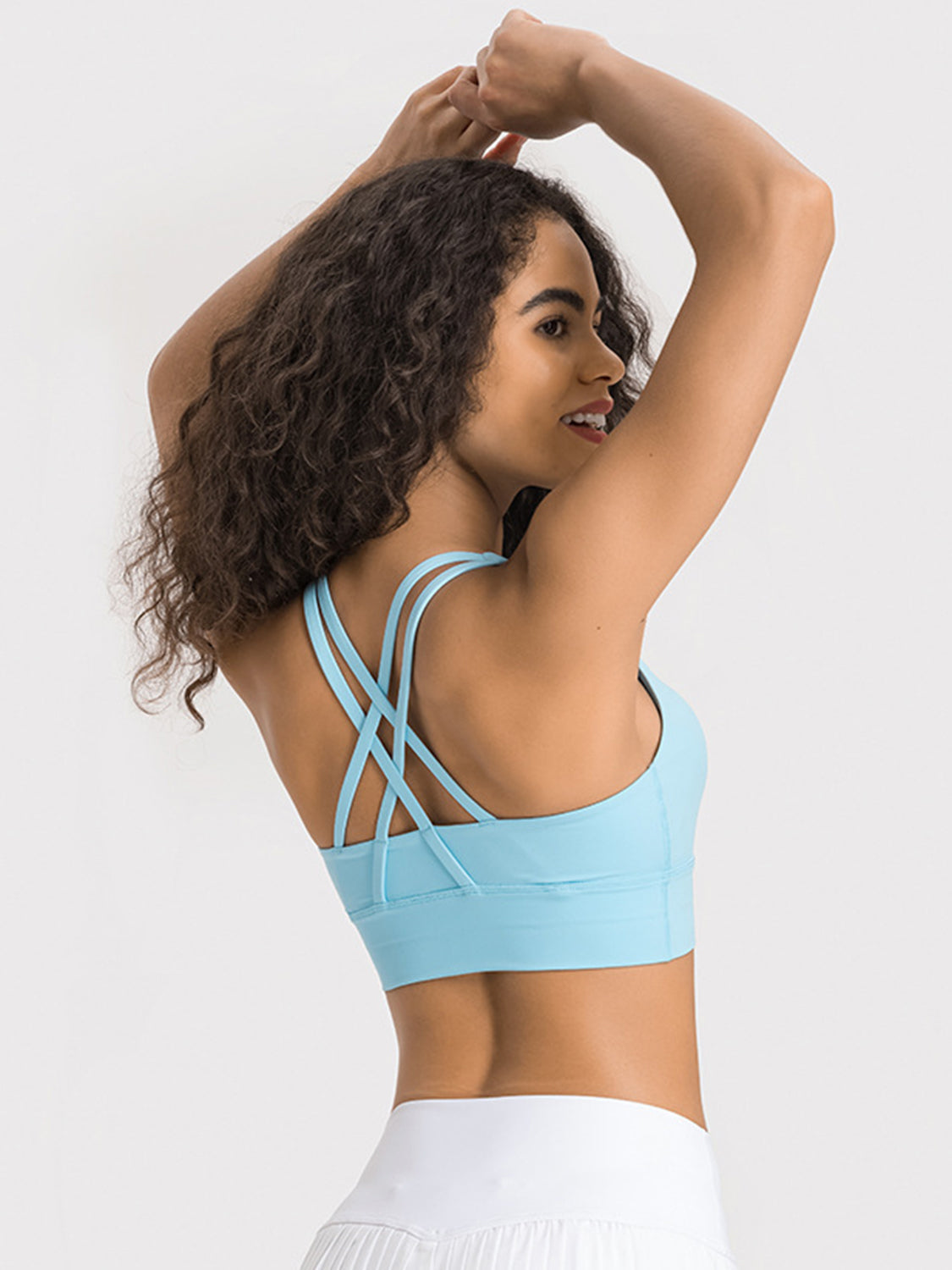 Pastel blue sports bra with crisscross back straps and wide band