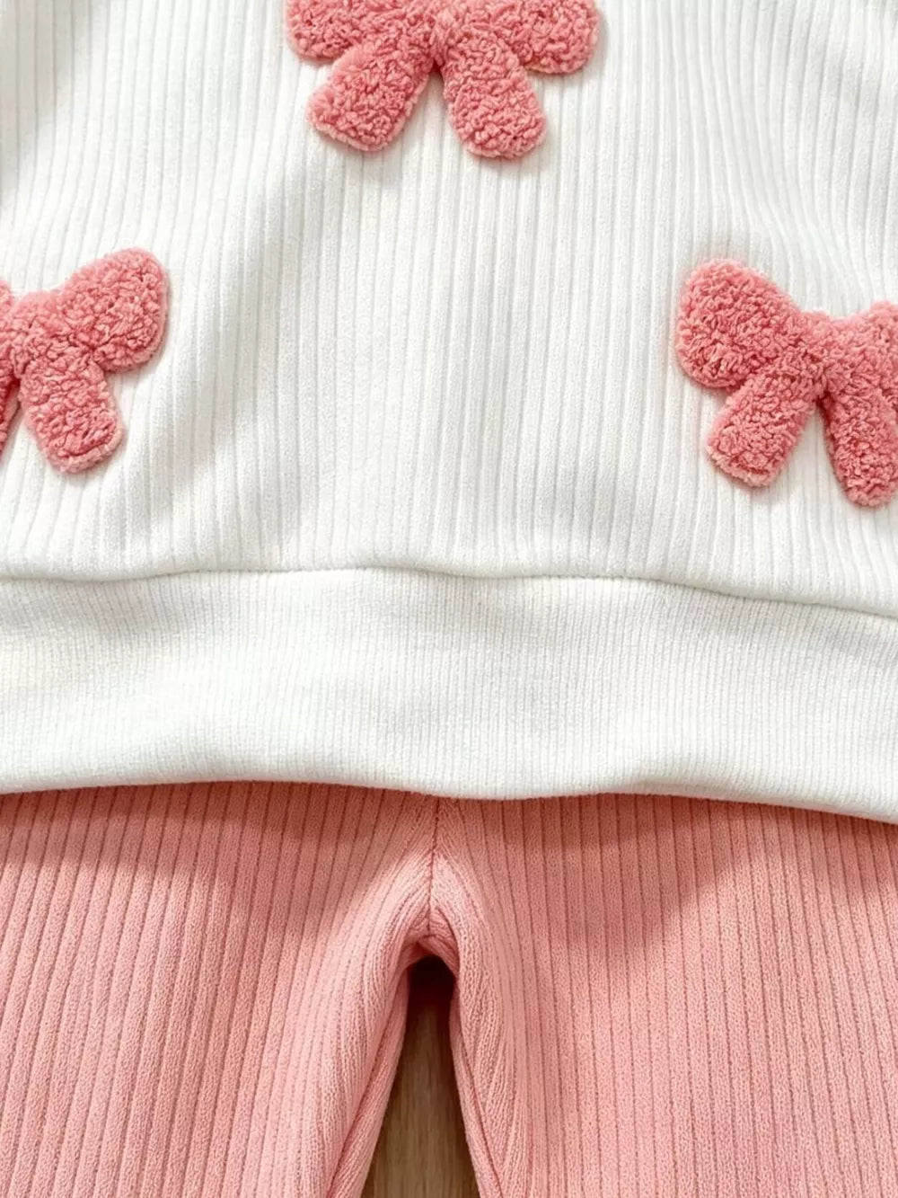 Children's Ruffled Long Sleeve Top And Flare Pants Set in White, close-up detail