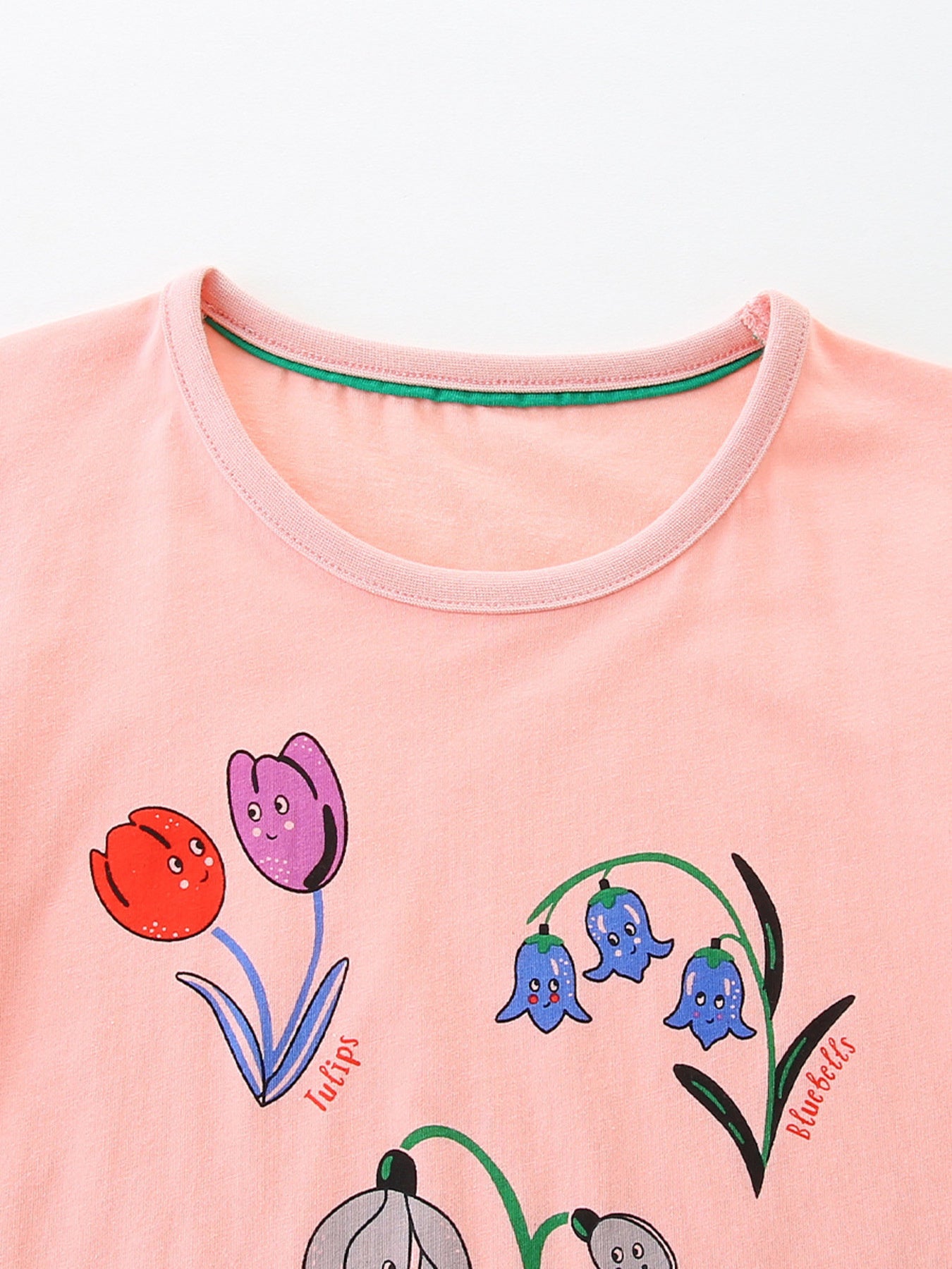 Toddler pink t-shirt with cartoon tulips and bluebells print.