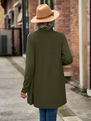 Moss green draped cascade cardigan with long sleeves and open front, styled with a hat.