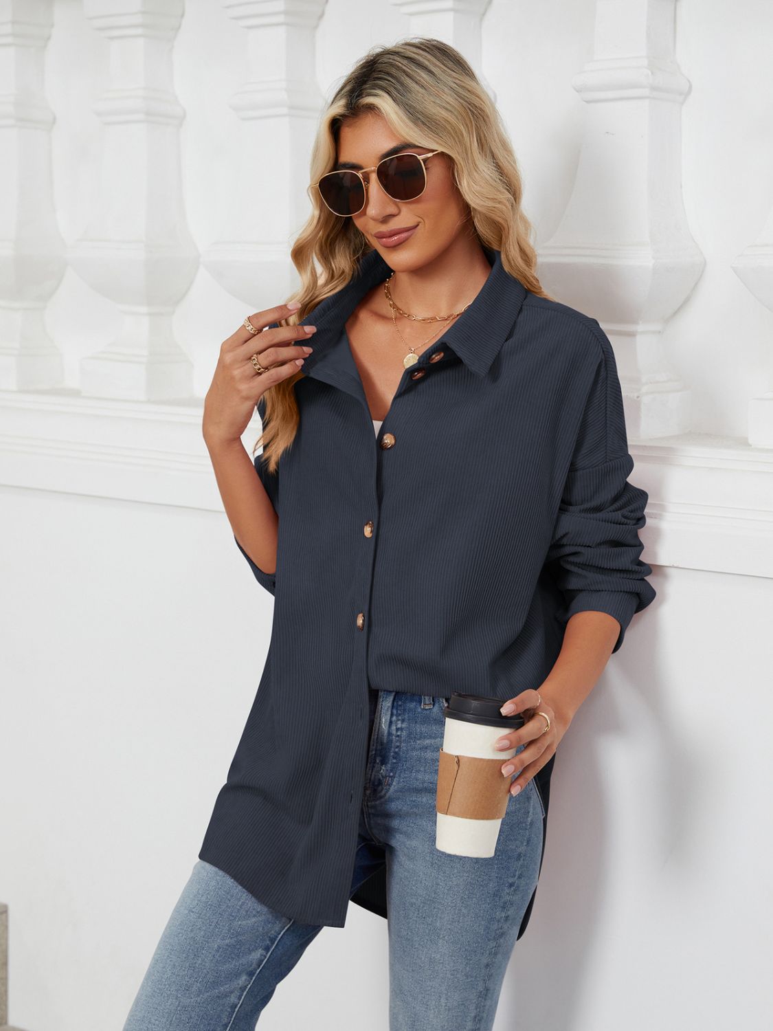 Dark Navy oversized corduroy shirt jacket with button front and collar, styled casually.