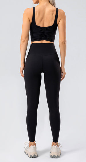 Black high-waist performance leggings with a seamless back detail.