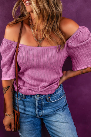 Red-violet knit blouse with square neckline and flutter sleeves, 100% viscose.