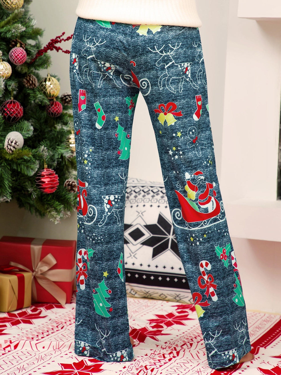 Festive print wide-leg lounge trousers in blue with Santa, reindeer, and Christmas tree patterns.