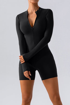 Black performance romper with zip detail and thumbholes