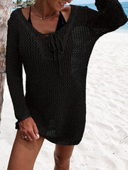 Black open-knit beach dress with lace-up neckline and long sleeves.