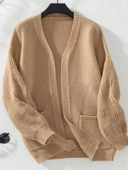 Camel chunky knit open-front cardigan with pockets and textured sleeves.
