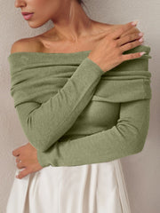 Sage off the shoulder knit sweater with long sleeves and a draped neckline.