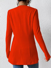 Red single-button blazer with tailored fit and textured fabric.