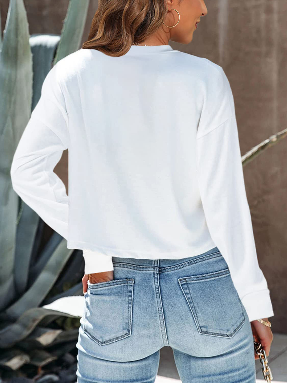 White cropped crewneck long sleeve top with relaxed fit