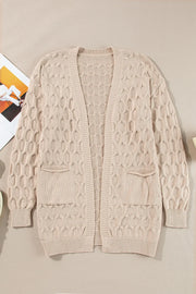 Textured cable knit open cardigan in dust storm with two front pockets.