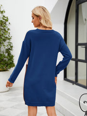 Colorblock sweater dress with vertical panels in royal blue, coral, and brown.