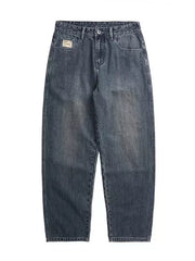 Relaxed fit vintage wash jeans in blue denim with a subtle faded effect.