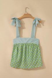 Floral tie-strap tank top with square neckline and green floral print.