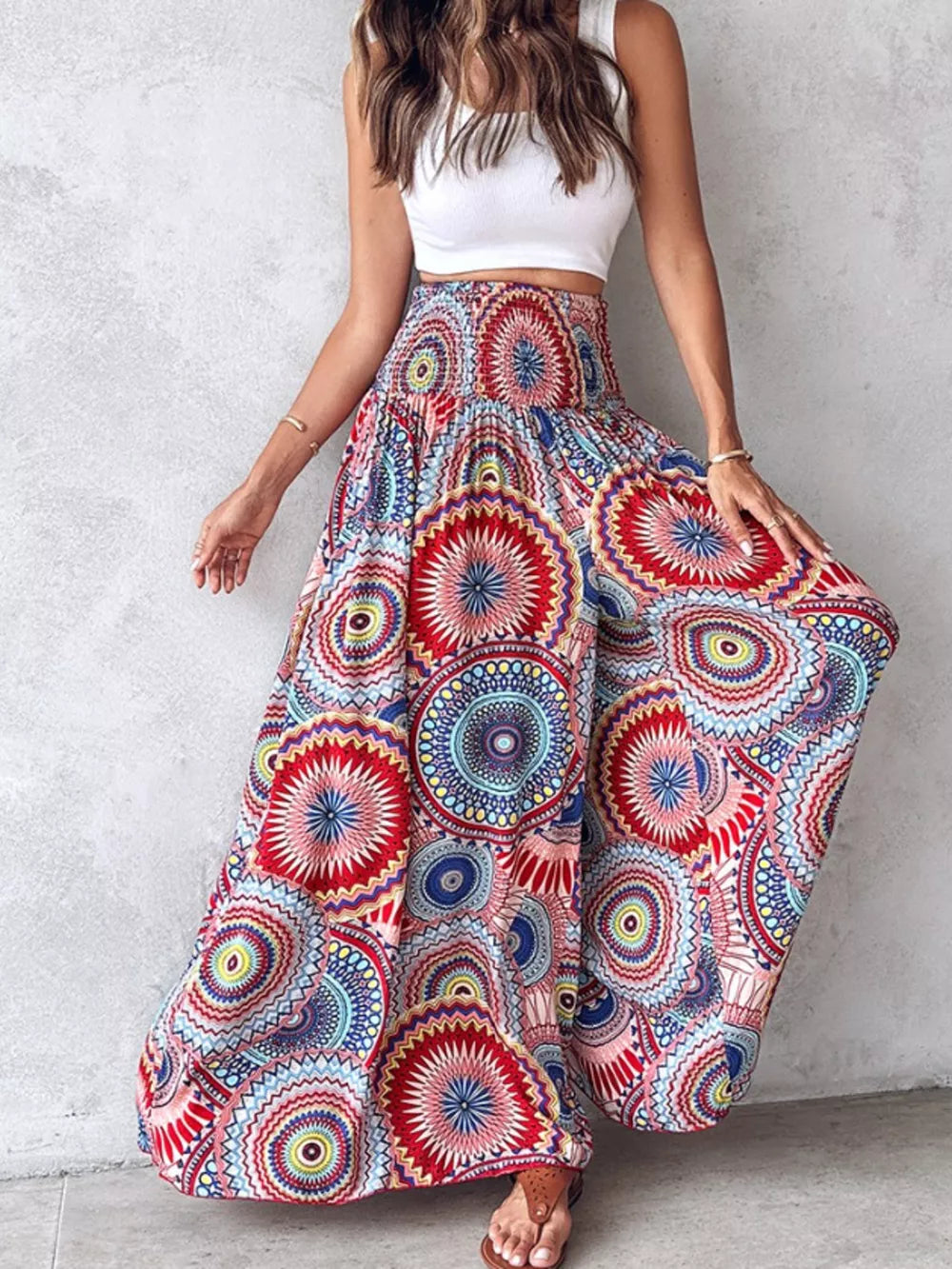 Bohemian print wide-leg pants with smocked waist in a vibrant, multicolored mandala pattern.