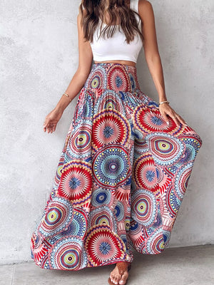 Bohemian print wide-leg pants with smocked waist in a vibrant, multicolored mandala pattern.