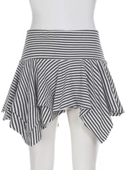 Asymmetrical hem mini skirt with black and white stripes and a tiered, ruffled design.