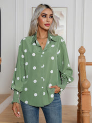 Light green polka dot blouse with shirred cuffs and button front.